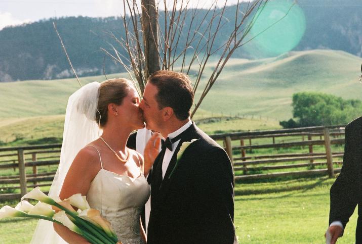 mike kisses the bride! - Laurie & Mikes Wedding - HF Bar Ranch Saddlestring, Wyoming